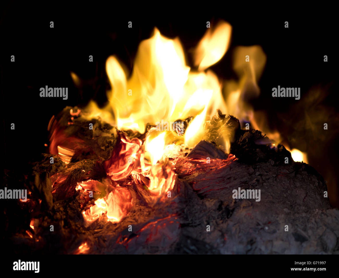 The tradition of burning paper gold, paper money believed the Chinese for ancestor worship ceremonies. Stock Photo