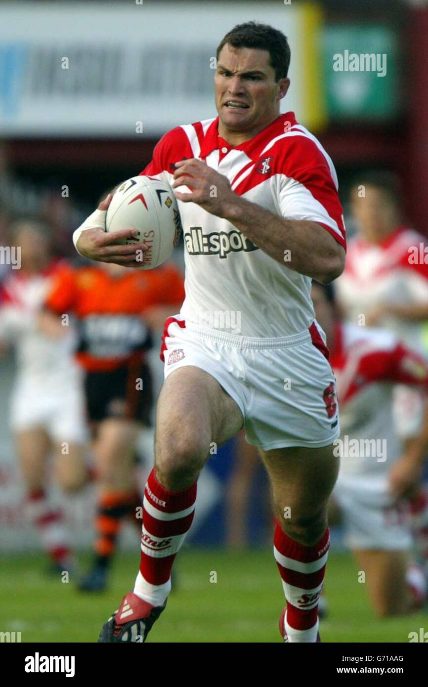St Helens' Jason Hooper races away to score the first try of the game