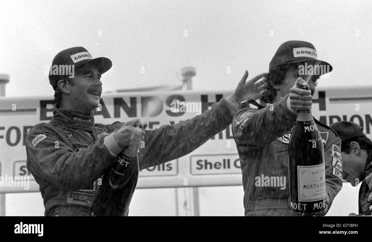 The victory rostrum hosts a double celebration, Nigel Mansell (left) who won his first world championship race, Shell Oils Grand Prix of Europe, and Alain Porst who became the first Frenchman to take the drivers' World Championship by finishing fourth in the race, at Brands Hatch, Kent. Stock Photo