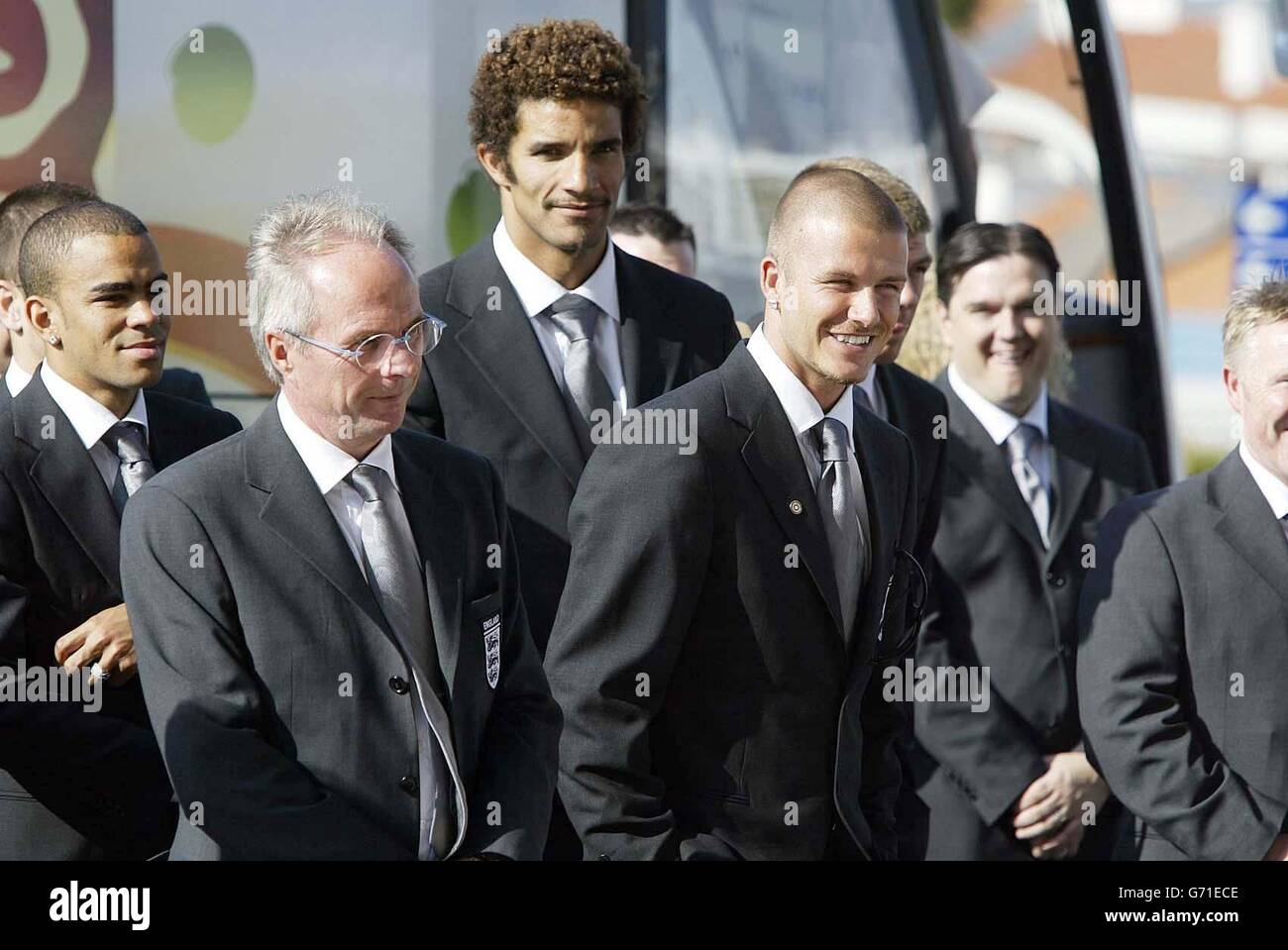 The England football squad led by captain David Beckham (fourth left) and manager Sven Goran Eriksson (second left) arrive at the Solplay Hotel in Portugal for the Euro 2004 tournament. England will play their opening first round match against France on Sunday. Stock Photo