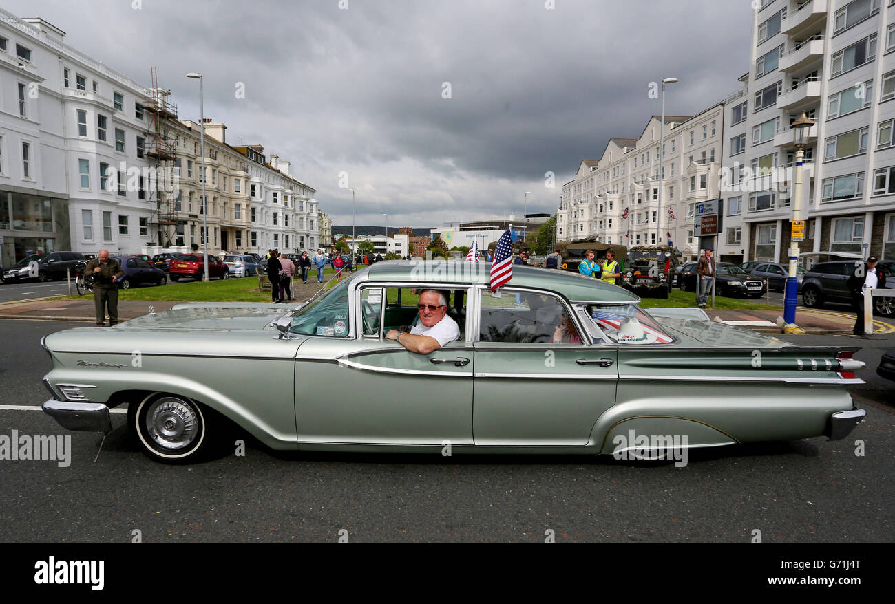 Eric Collard drives his 1959 Mercury Monterey along the seafront in Eastbourne, Sussex, at the start of the second day of Magnificent Motors, as around 600 vintage and classic vehicles take part in the largest free motoring spectacular on the south coast. Stock Photo