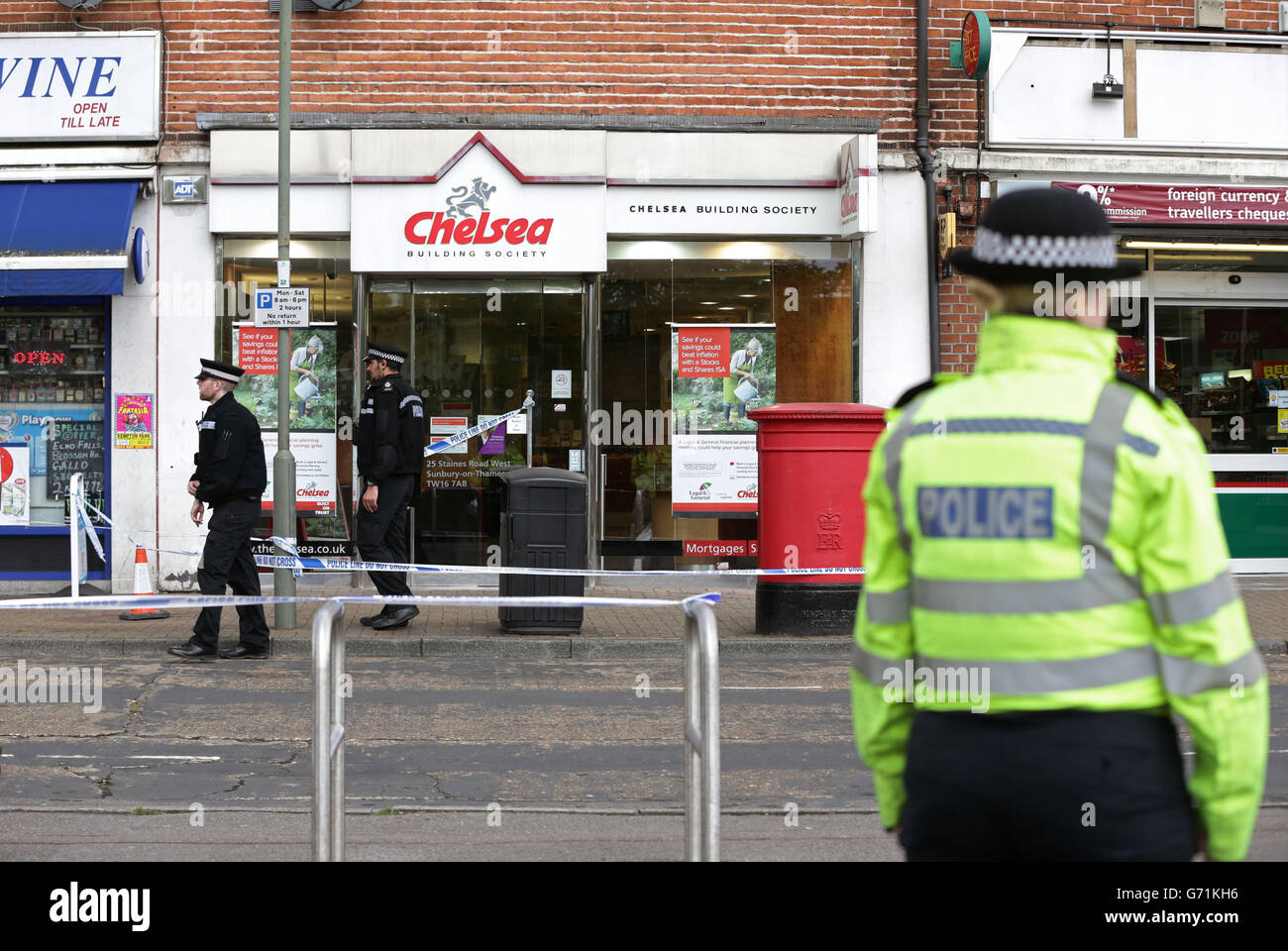 Police outside a branch of the Chelsea Building Society in Sunbury-on-Thames, Surrey which was robbed today, Police are investigating whether armed robber Michael Wheatley also known as the 'Skull Cracker' has struck again. Stock Photo