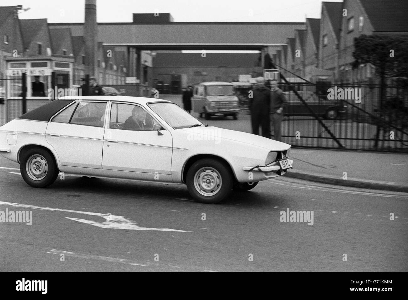 A new car model passing the gates of British Leyland's troubled Cowley