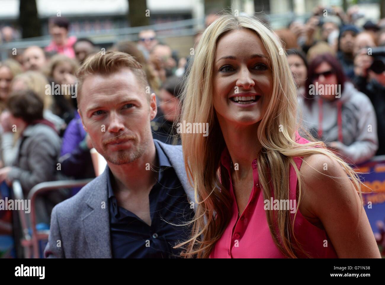 Ronan Keating, who is Postman Pat's singing voice, with girlfriend Storm Uechtritz arrives for the premiere of Postman Pat: The Movie at the Odeon, West End, London. Stock Photo
