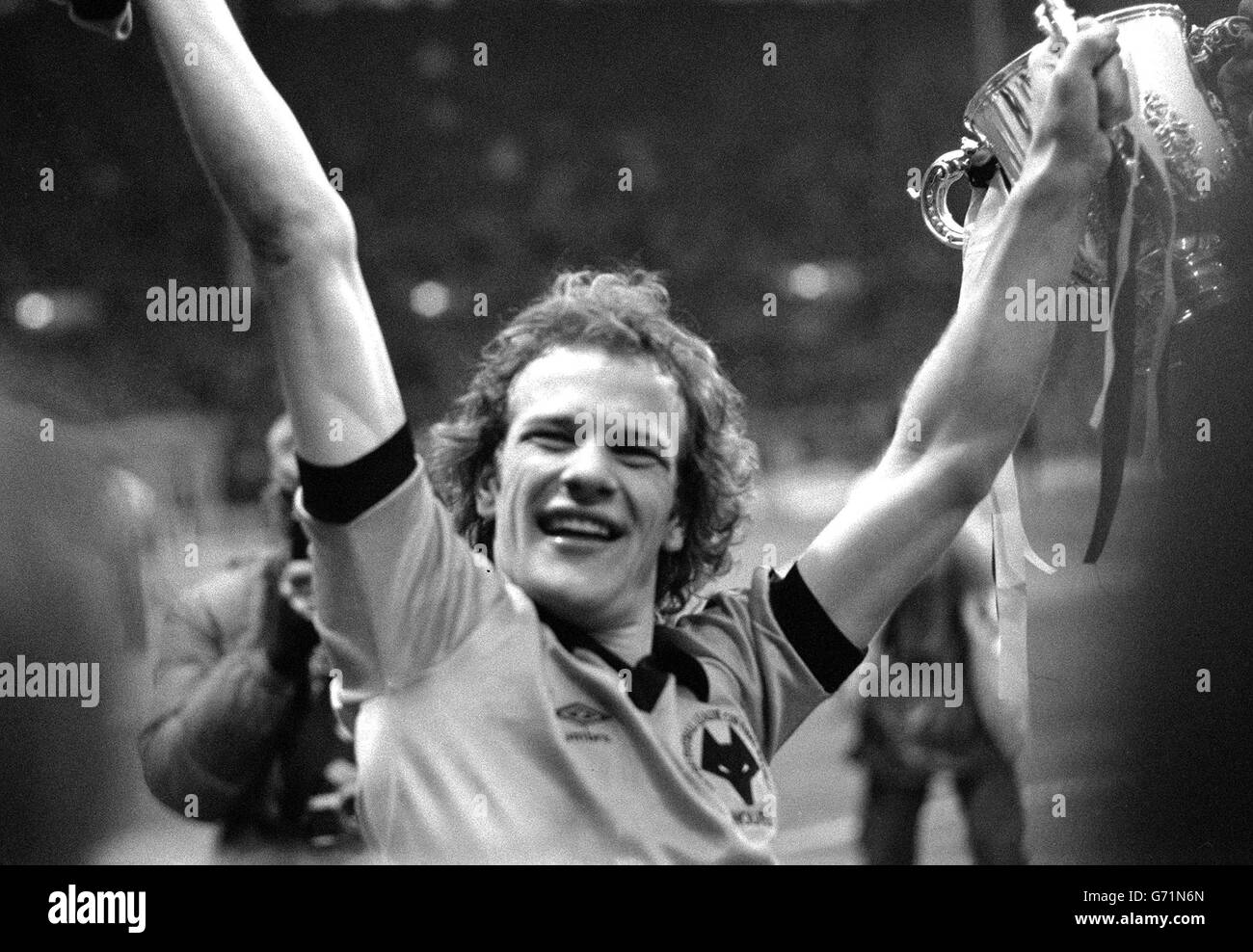 A delighted Andy Gray of Wolverhampton Wanderers holds aloft the trophy after his 67th minute goal brought victory over Nottingham Forest in the Football League Cup Final at Wembley . Stock Photo