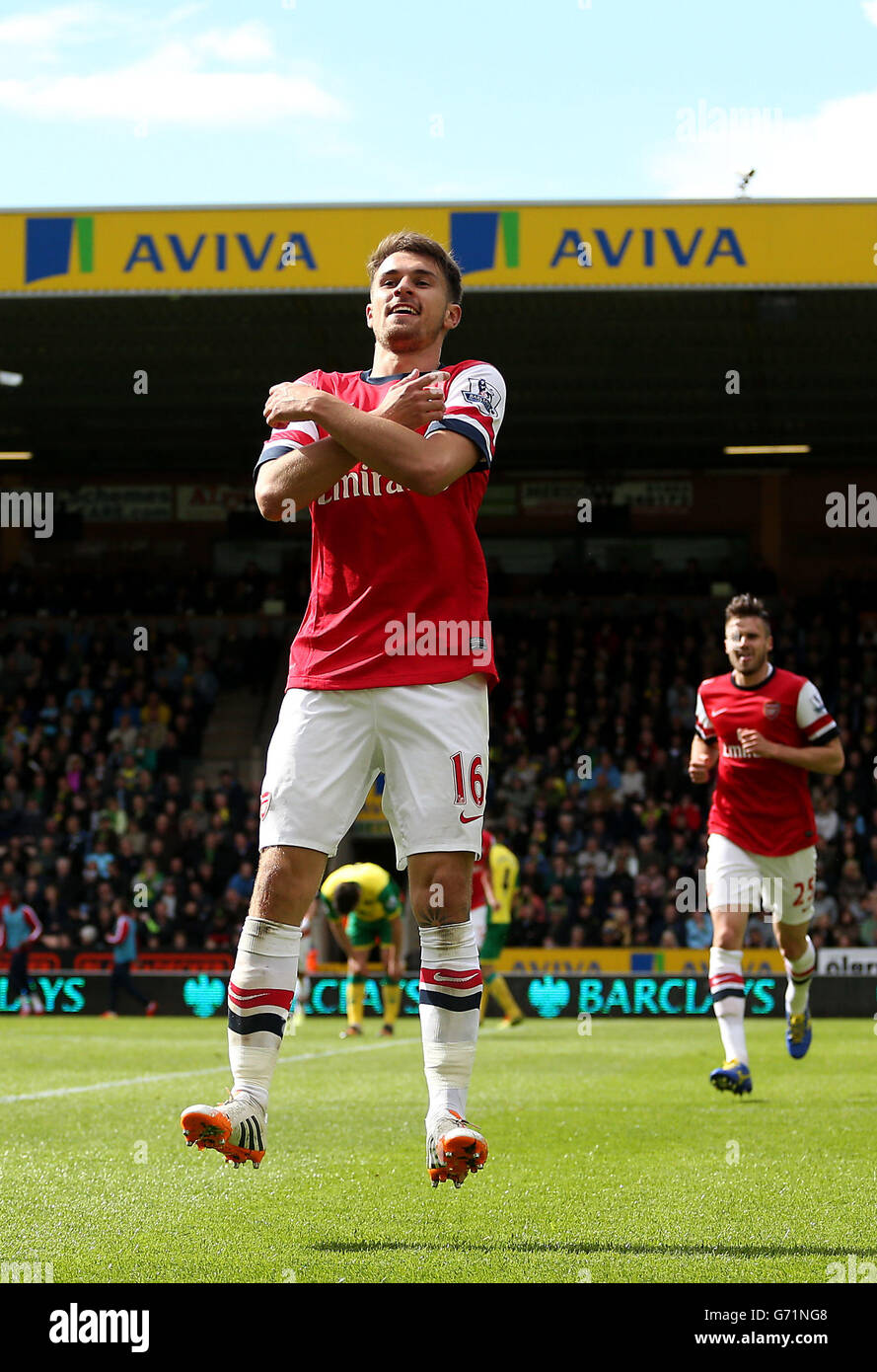 Arsenal's Aaron Ramsey celebrates scoring the first goal during the Barclays Premier League match at Carrow Road, Norwich. Stock Photo
