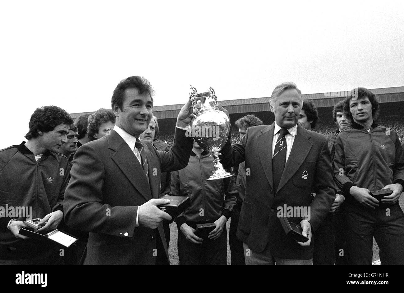 Nottingham Forest manager Brian Clough (left) and assistant manager Peter Taylor, holding the League Championship trophy after it had been presented to Forest at the County Ground in Nottingham. 20/09/04: The former Forest and Derby County manager has died. A hospital spokeswoman said Brian Clough, who was 69, had been suffering from stomach cancer. Stock Photo