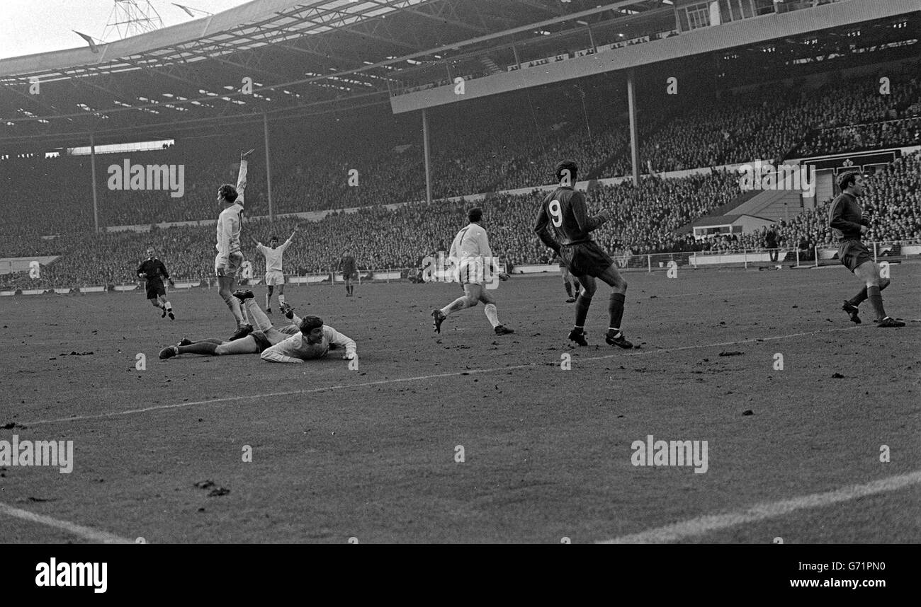 Queens Park Rangers players hail the third and winning goal scored by Lazarus, who turns away after putting the ball past West Bromwich Albion goalkeeper Sheppard in the Football League Cup final at Wembley. Stock Photo