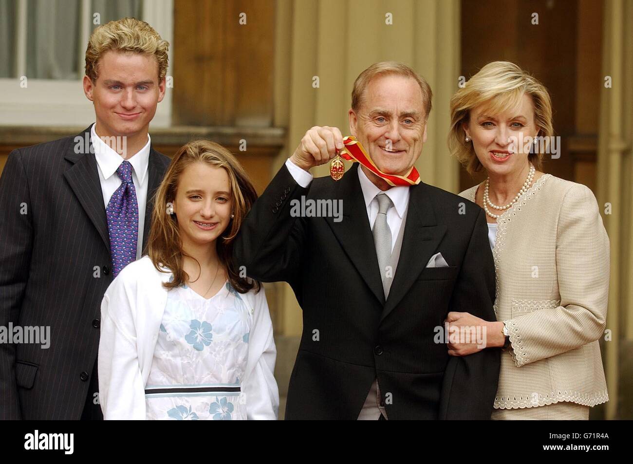 Sir Harold Evans at Buckingham Palace in London, with his wife, Tina