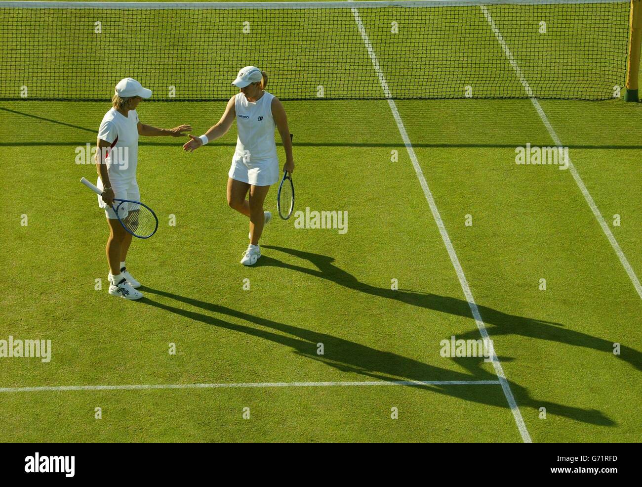 Martina Navratilova and Lisa Raymond from the USA celebrate a point in their doubles match against Jill Craybass and Marlene Weingartner at The Lawn Tennis Championships in Wimbledon, London. Navratilova and Raymond won in straight sets 6:2/6:4. Stock Photo