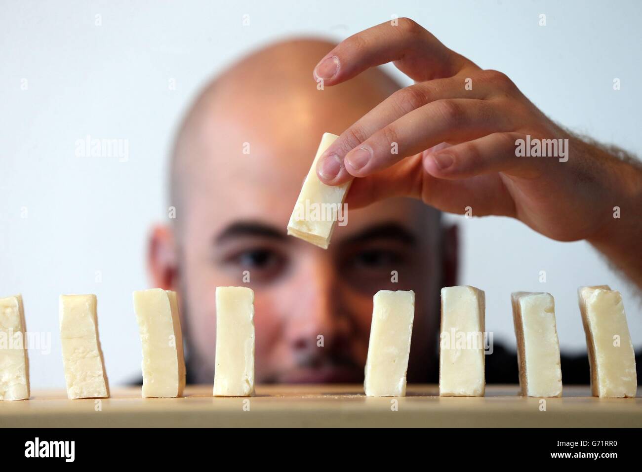 Miami based artist Orestes De Le Paz holds bars of soap made from his own body fat after he underwent Liposuction Surgery, on show during a press preview of Fat: It's Delicious, a free Lab in the Gallery exploring the good, the bad and the beauty of fat at Science Gallery at Trinity College. Stock Photo