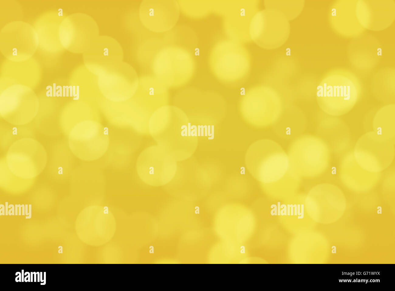 Abstract circular gold and yellow light bokeh background Stock Photo