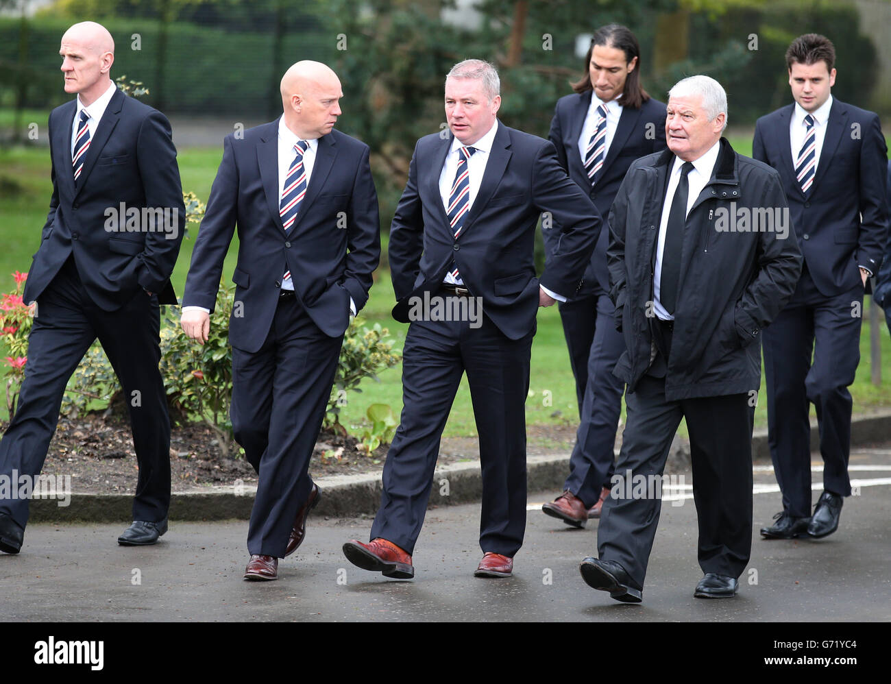 Current Rangers players and management including manager Ally McCoist (centre) at the funeral of ex Rangers footballer Sandy Jardine at Mortonhall crematorium in Edinburgh. Stock Photo