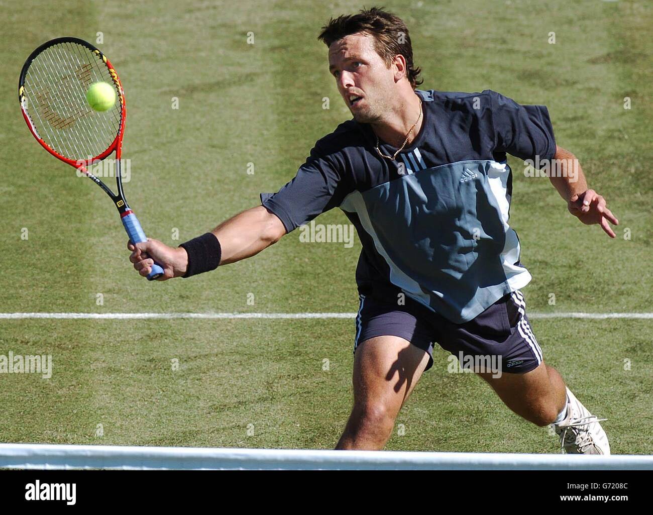 The Nottingham Open Tennis Tournament. Lee Childs of Great Britain plays Hicham Arazi in their first round match at the Nottingham Open tennis tournament. Stock Photo