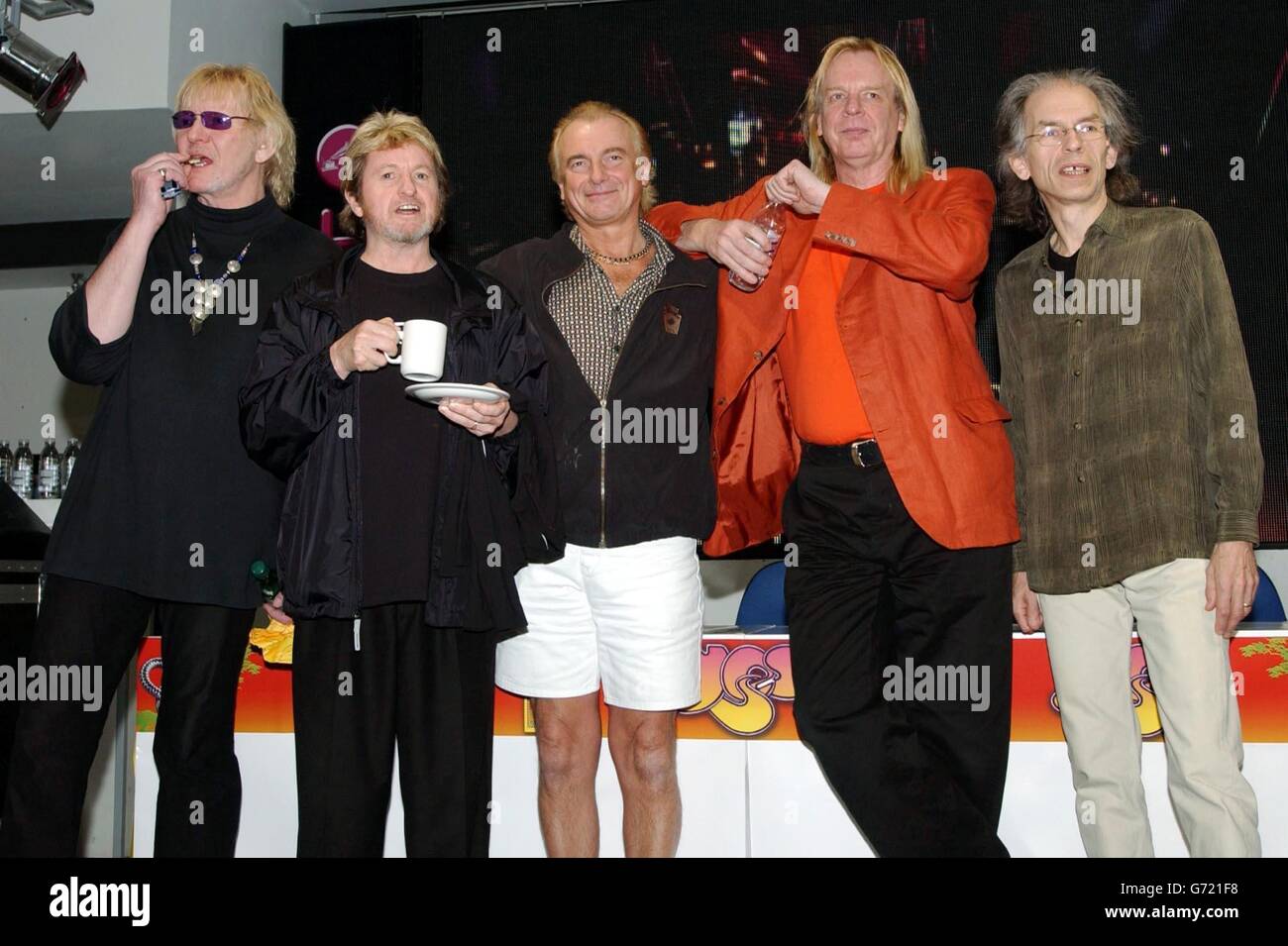 70s rock band Yes (left-right) Chris Squire, Jon Anderson, Alan White, Rick Wakeman and Steve Howe during a in-store signing for their new DVD 'Yes Acoustic', at HMV Oxford Street, central London. Stock Photo