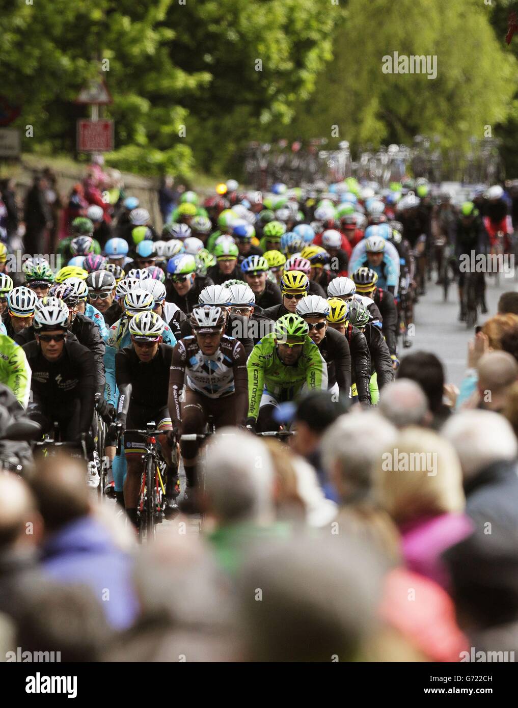 The peloton makes it's way up Antrim road past Templepatrick during Stage two of the 2014 Giro D'Italia in Belfast. Stock Photo