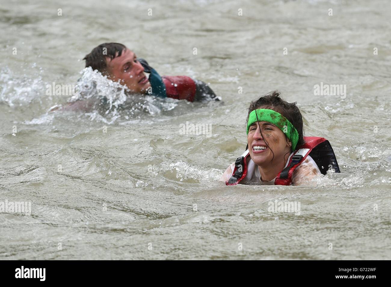 Competitors take part in Rat Race Dirty Weekend at Burghley House in Lincolnshire. Stock Photo