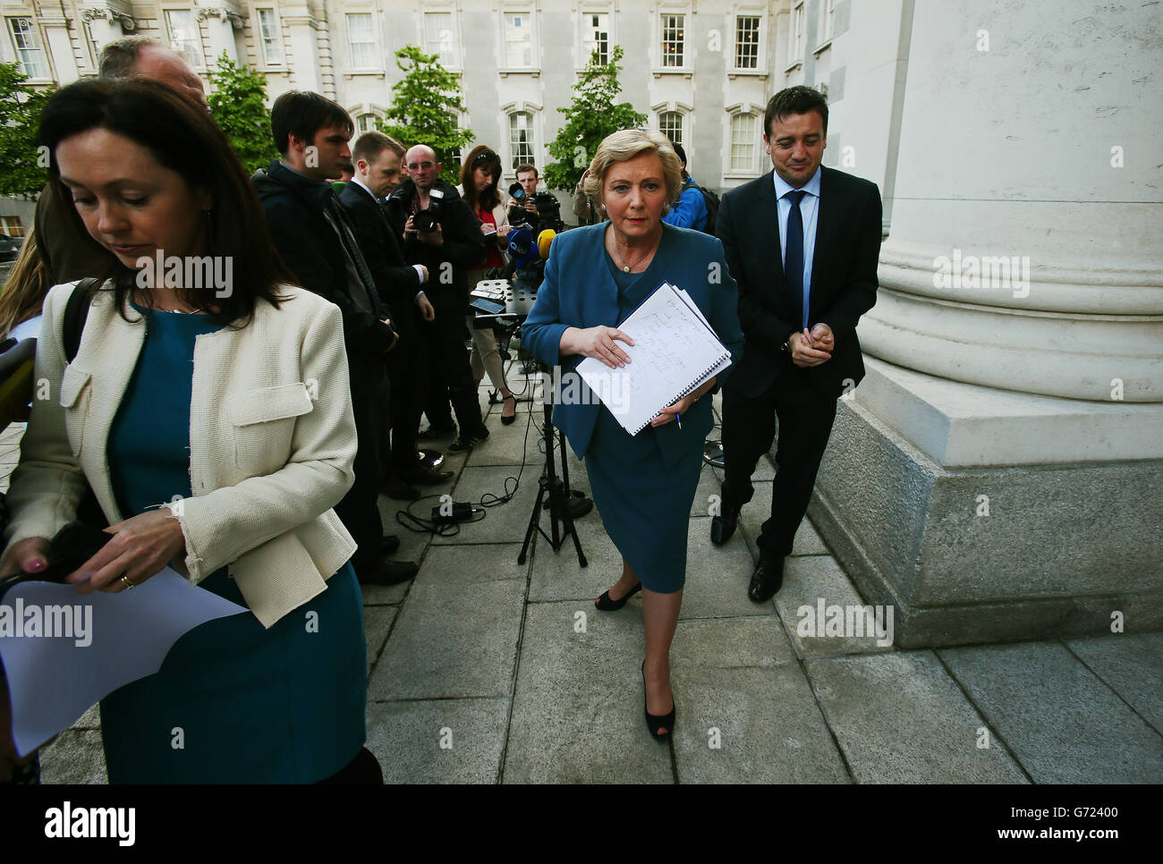 Newly appointed Justice Minister Frances Fitzgerald (centre) leaving after speaking to the media at Government Buildings, Dublin. Stock Photo