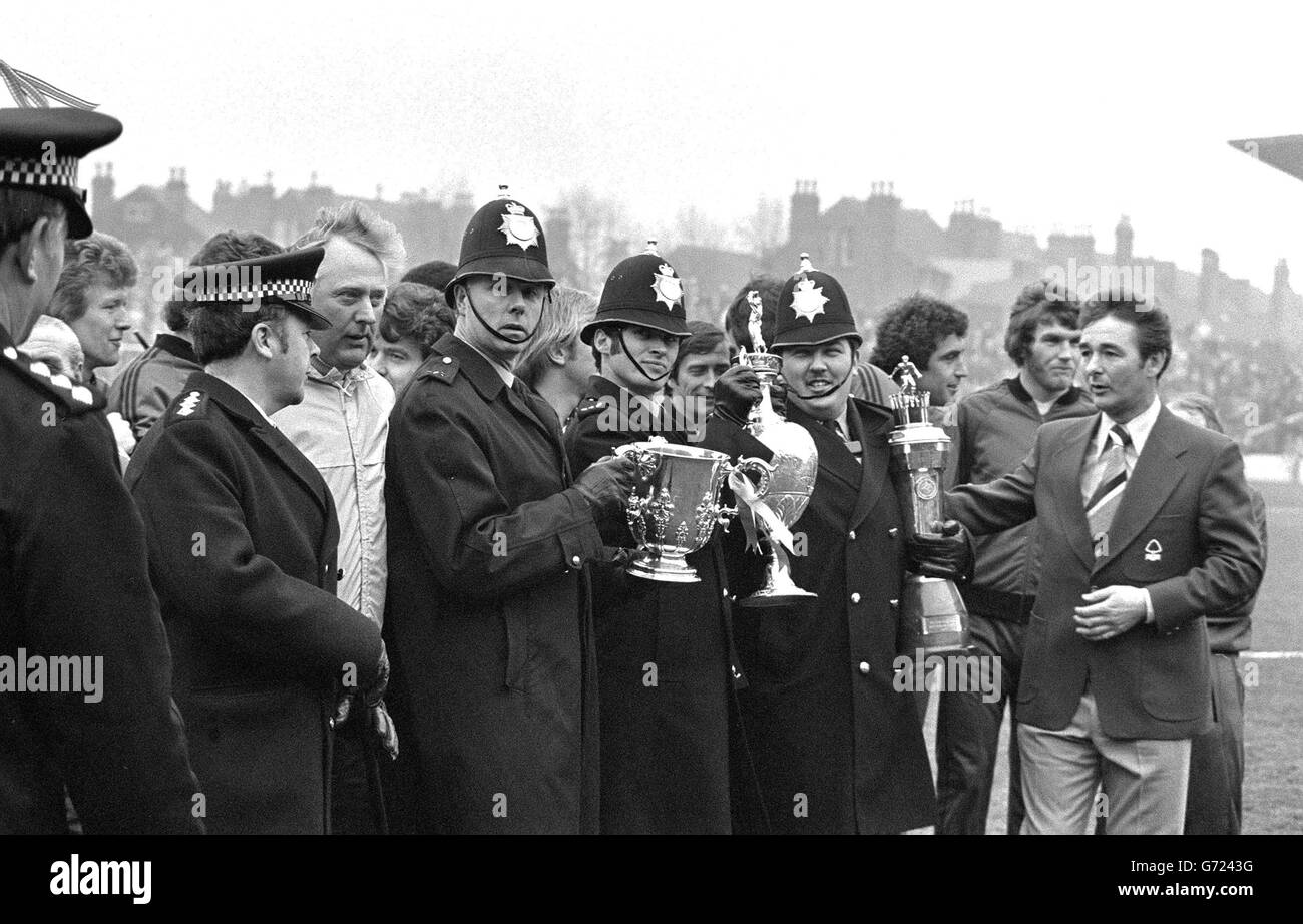 Three police stalwarts marshalled together by Nottingham Forest manager Brian Clough (extreme right) after the testimonial match between Nottingham Forest and Derby County for Brian Clough and Peter Taylor. Forest won 2-1. Stock Photo