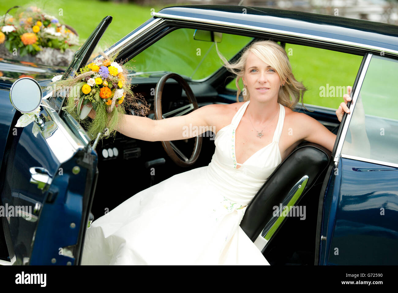Bride in a classic car Stock Photo - Alamy