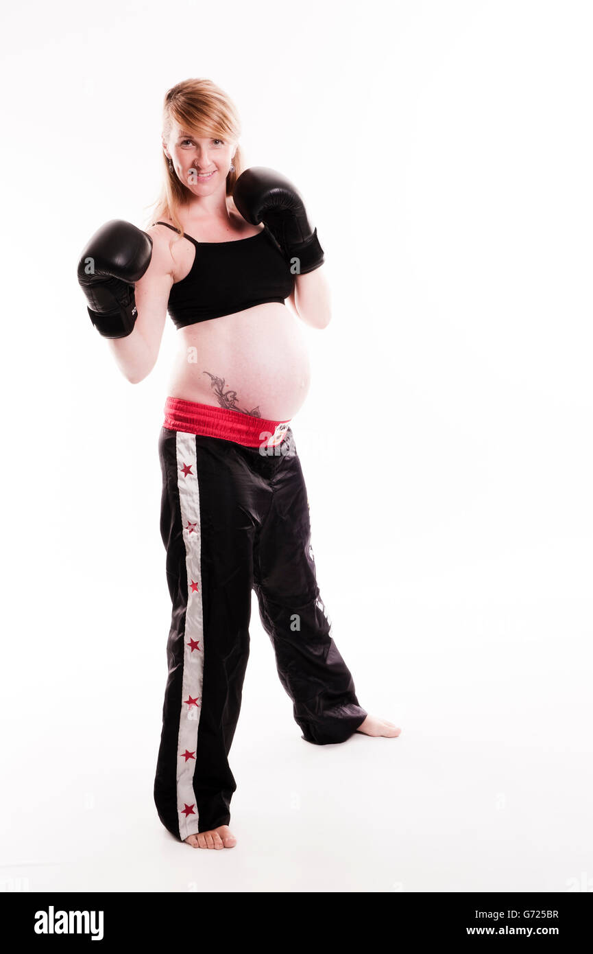 Pregnant woman wearing boxing gloves Stock Photo Alamy
