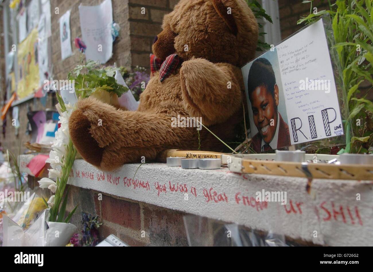 Tributes for mudered schoolboy Kieran Rodney-Davis mount up at a memorial service for the 15-year-old at the spot where he was murdered on Sulivan Court in Fulham, west London. Kieran was stabbed to death there for his mobile phone and two 16-year-olds are in custody allegedly accused of the murder. Stock Photo