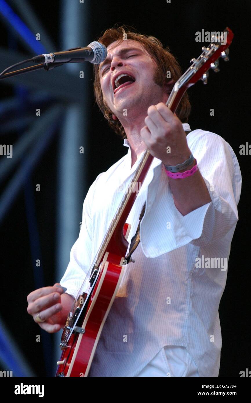 Celebrity showbiz performing on stage festival guitar playing gaz