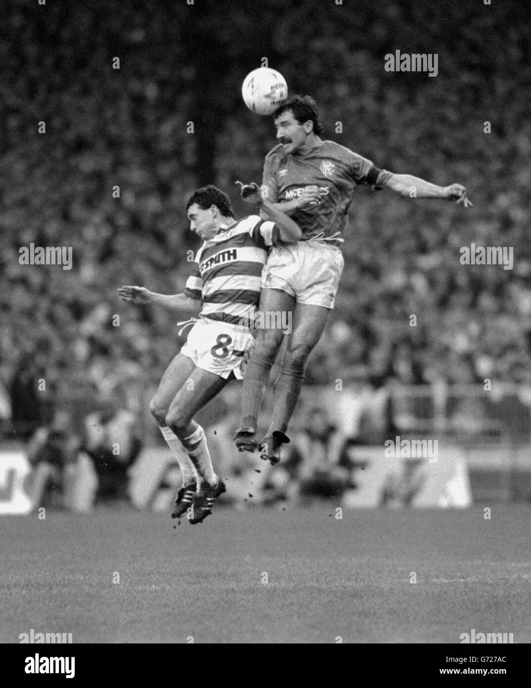 Rangers' player-manager Graeme Souness (right) gets to the ball ahead of Celtic's Paul McStay during the Old Firm clash at Parkhead which Celtic won 2-0. Stock Photo