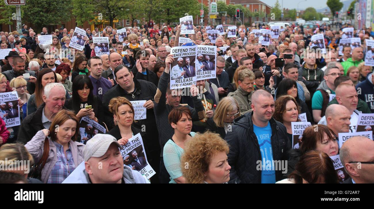 Sinn Fein supporters attend the unveiling of Gerry Adams in the Falls Road, Belfast, as Deputy First Minister Martin McGuinness has reiterated his belief that the Adams' arrest is politically motivated and accused members of the Police Service of Northern Ireland of being against the peace process. Stock Photo