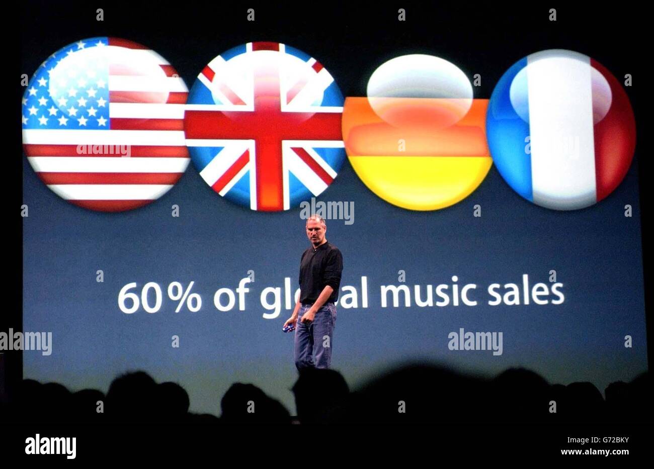 Apple CEO Steve Jobs at the launch of the world's first online music market in Europe, held at the Old Billinsgate Market in London. The iTunes on-line music store will allow users to download a song for just 79p and albums from 7.99p. Stock Photo