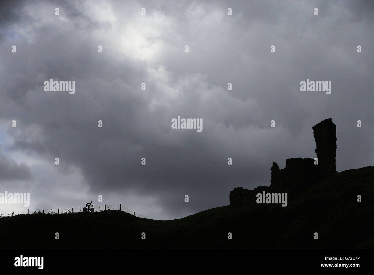 STAND ALONE. A silhouette of a promotional billboard shaped like a cyclist on the route of the Giro D'Italia at Redbay Castle in Co Antrim, Northern Ireland. Stock Photo