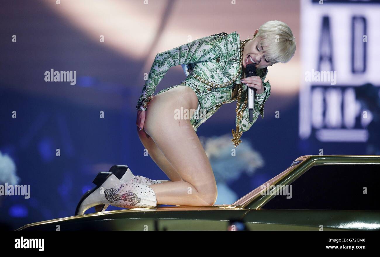 Miley Cyrus concert - London. Miley Cyrus performs in concert at the O2 Arena, London, on the UK leg of her Bangerz tour. Stock Photo