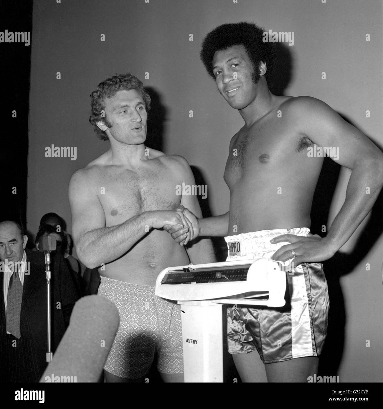 Great Britain's Joe Bugner (l) and American Jimmy Ellis during the weigh-in at the Dominion. Bugner and Ellis will meet each other in the ring at Wembley later in the evening. Stock Photo