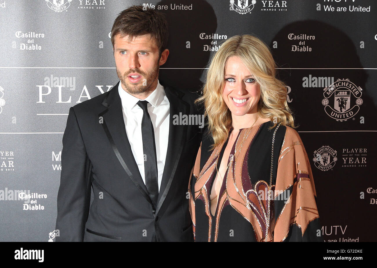 Soccer - 2014 Manchester United Player of the Year Awards - Arrivals - Old Trafford. Manchester United's Michael Carrick and wife Lisa arrive for the Manchester United Player of the year Awards at Old Trafford, Manchester. Stock Photo