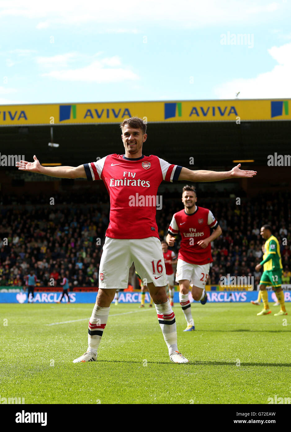 Arsenal's Aaron Ramsey celebrates scoring the first goal during the Barclays Premier League match at Carrow Road, Norwich. Stock Photo