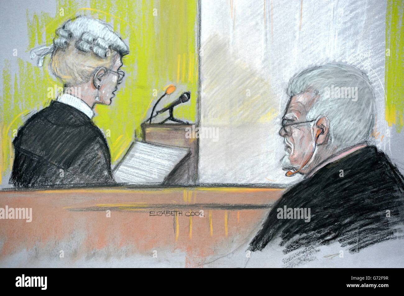 Court artist sketch by Elizabeth Cook of Rolf Harris in the dock at Southwark Crown Court, London as prosecutor Sasha Wass QC questions a witness who is evidence behind a curtain. Stock Photo