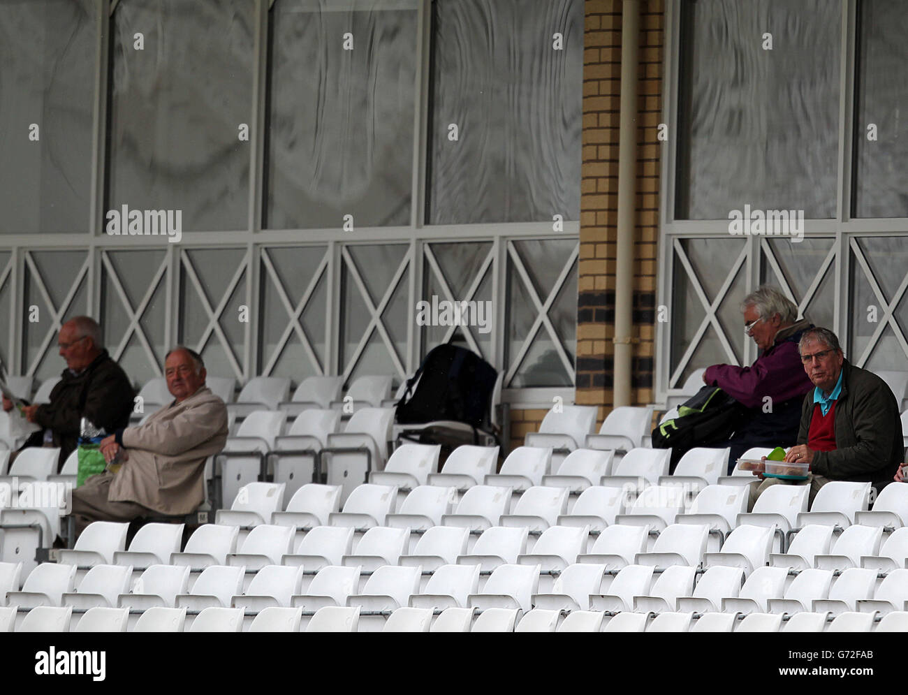 Spectators wait for play to start as rain delays Day Two of the LV=County Championship Division One match at Trent Bridge, Nottingham. Stock Photo