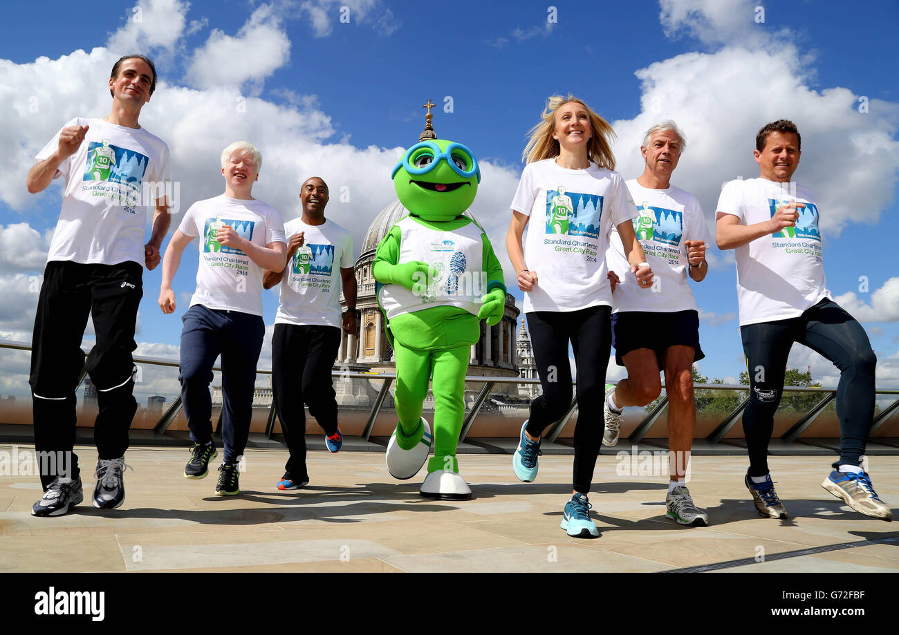 Richard Holmes, CEO Europe at Standard Chartered Bank (2nd right) with the 10th anniversary Standard Chartered Great City Race ambassadors, (left to right) Noel Thatcher, Jack Roughan, Colin Jackson, Paula Radcliffe, Mike Bushell and Seeing is Believing's mascot Sir SiB (centre) on the Rooftop Terrace at One New Change in London. Stock Photo