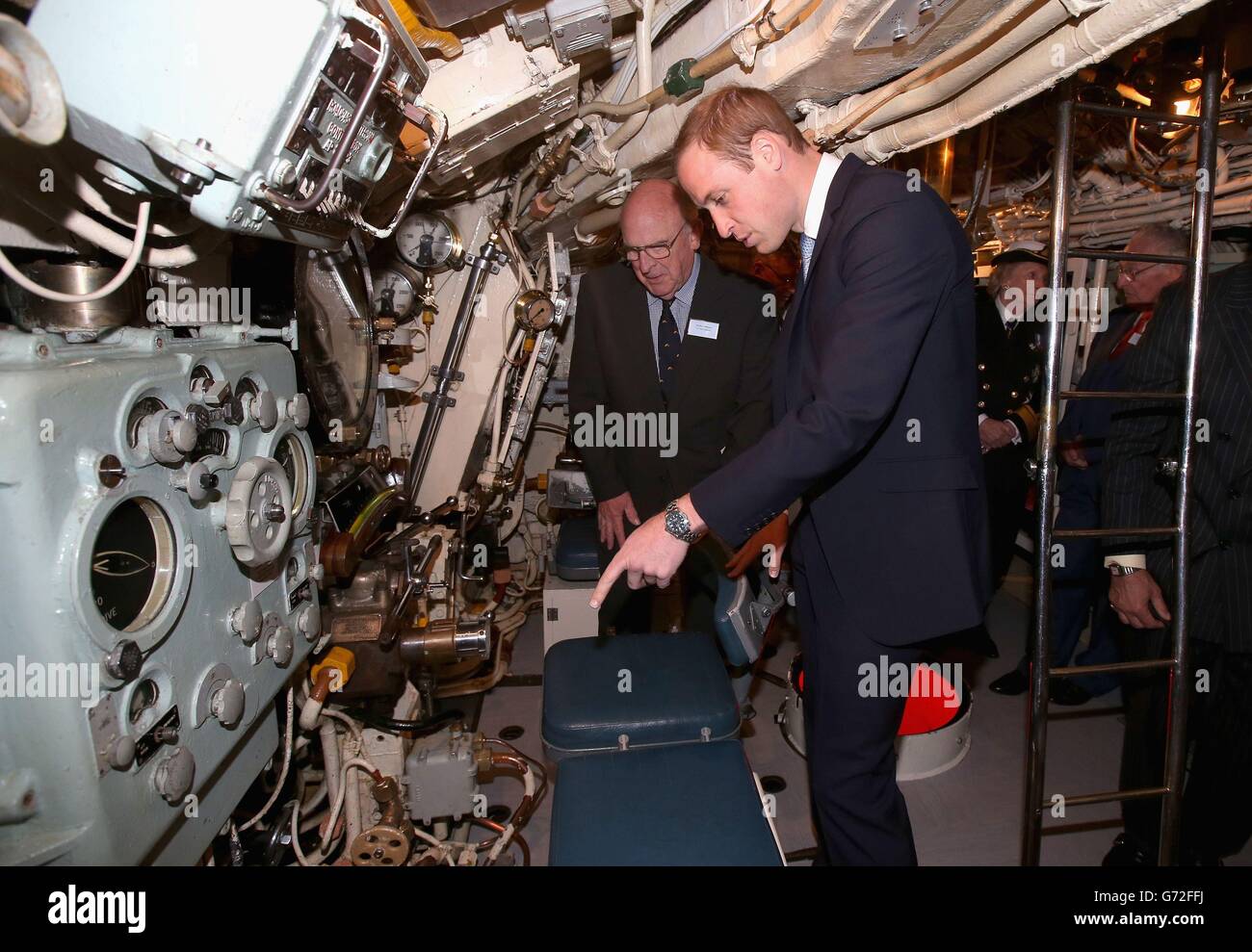 The Duke of Cambridge is shown the inner workings of the Submarine HMS Alliance at the Royal Navy Submarine Museum in Gosport. Stock Photo