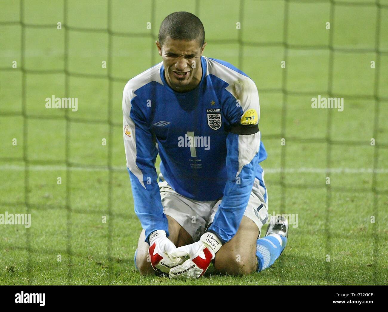 England's David James shows his dejection during the penalty shoot-out against Portugal during the Euro 2004 quarter-final match at the Estadio da Luz, Lisbon, Portugal. Stock Photo