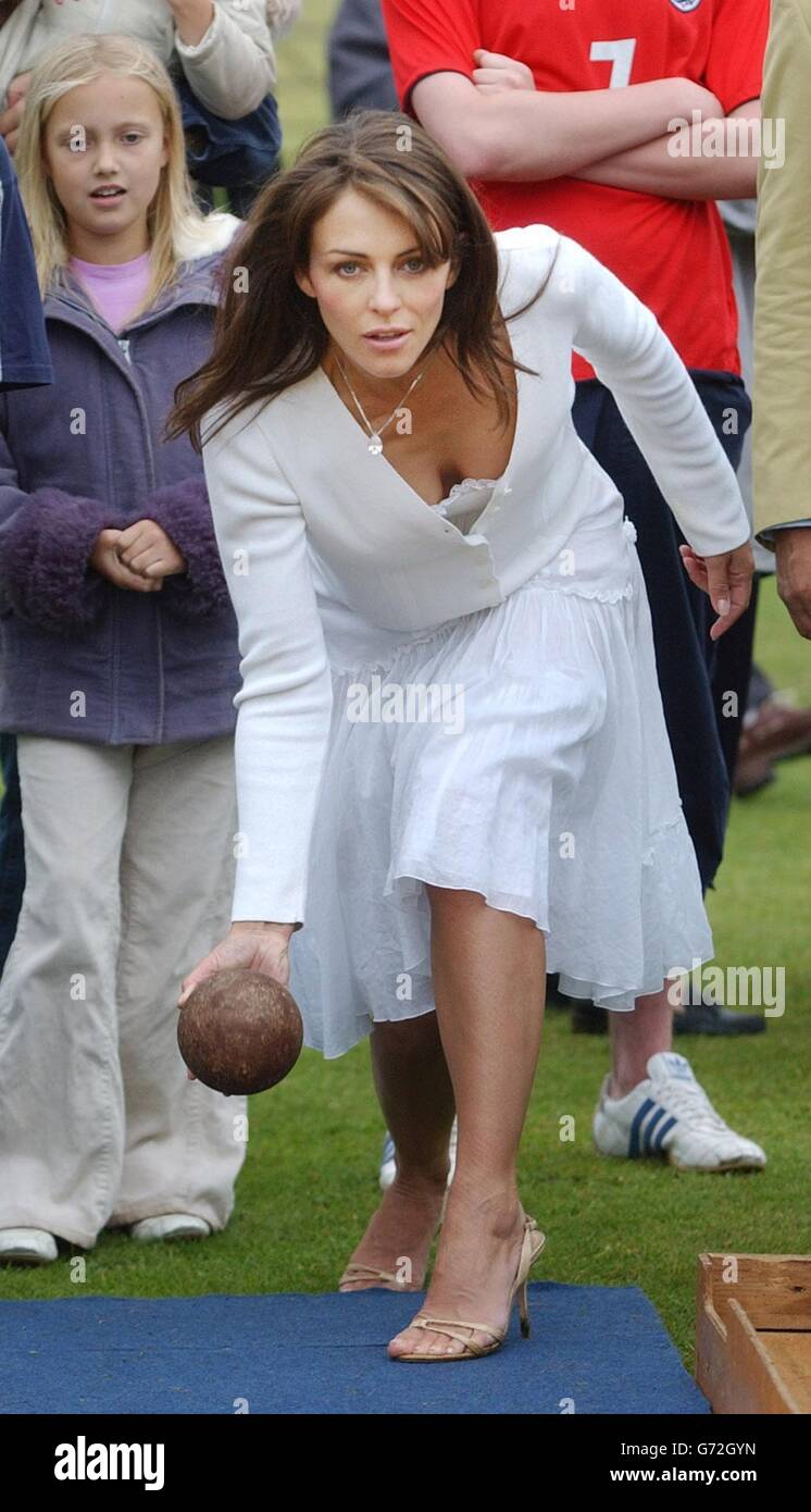 Elizabeth Hurley tries skittles after opening Ampney Crusis Fete. Stock Photo
