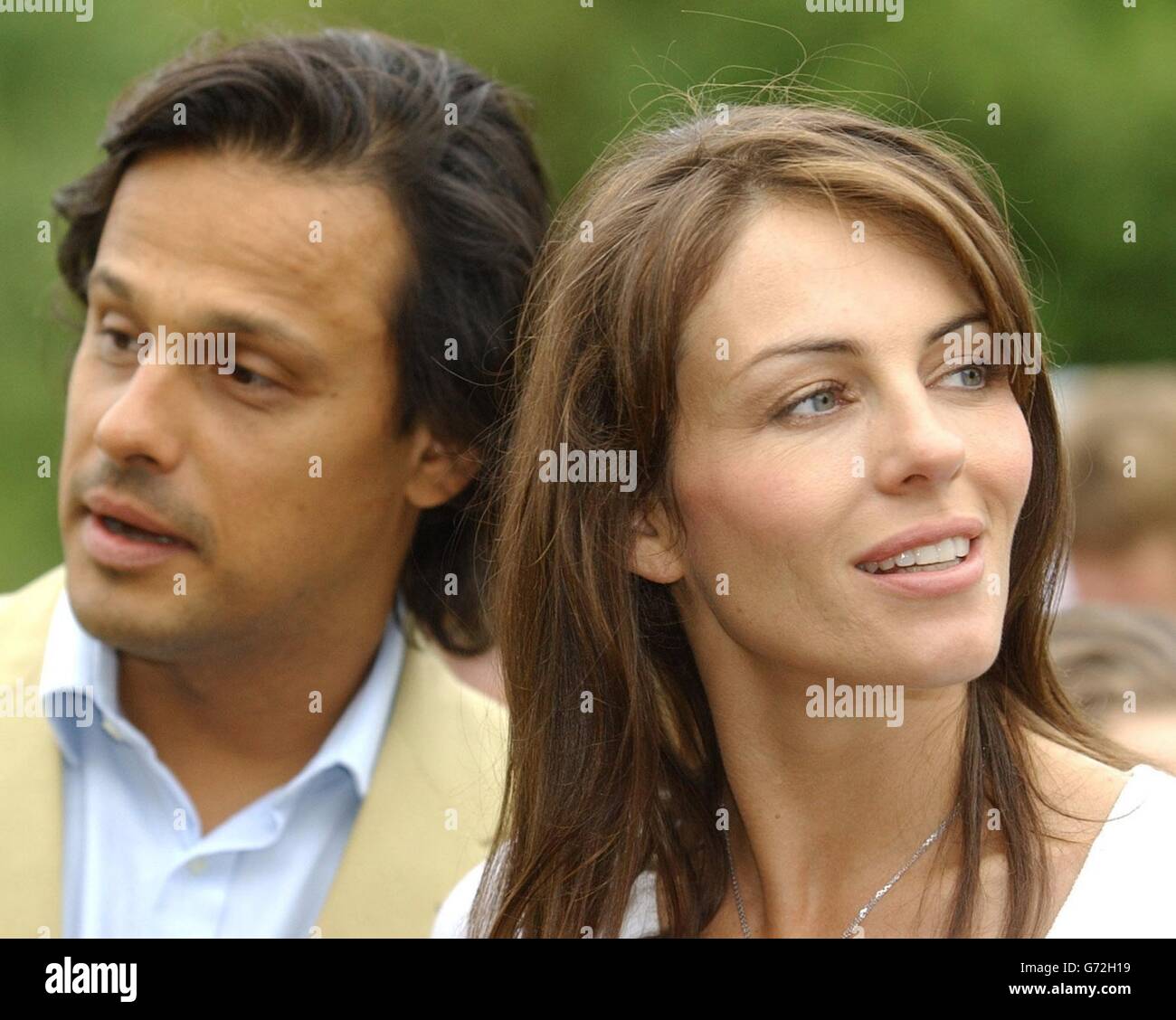 Elizabeth Hurley with boyfriend Arun Nayar arrive to open the Ampney Crusis Fete. Stock Photo