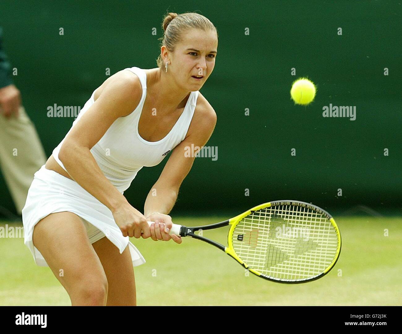 Karolina Sprem from Croatia in action against Meghann Shaughnessy from the USA at the Lawn Tennis Championships in Wimbledon, London. Sprem defeated former champion Venus Williams in her previous match to get into the third round and beat Shaughnessy in straight sets 7:6/7:6.. Stock Photo