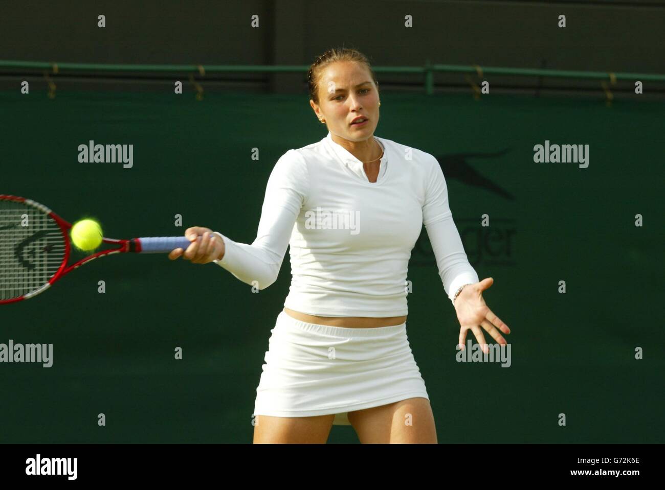 Severine Beltrame from France in action against Great Britain's Emily  Webley-Smith at The Lawn Tennis Championships in Wimbledon, London.  Webley-Smith won the match in straight sets 7:6/6:4. , NO MOBILE PHONE USE