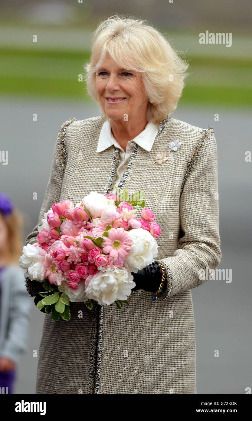 The Duchess of Cornwall holds flowers given to her on her arrival with the Prince of Wales, at Halifax Airport in Nova Scotia, Canada to start a four day trip to the country. Stock Photo