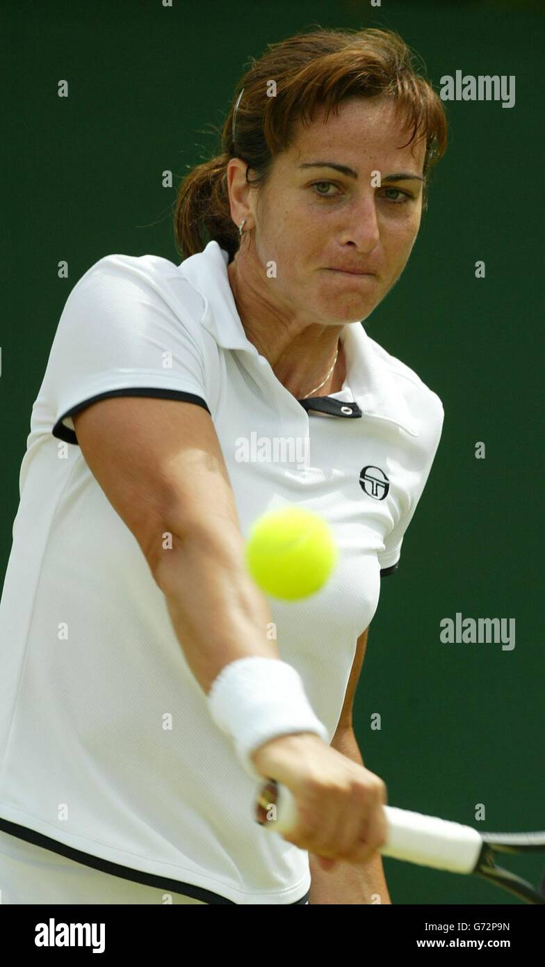 Silvia Farina Elia from Italy in action against Virginia Ruano Pascual from Spain at the Lawn Tennis Championships in Wimbledon, London. Farina Elia won in three sets 2:6/6:4/7:5. , NO MOBILE PHONE USE. Stock Photo