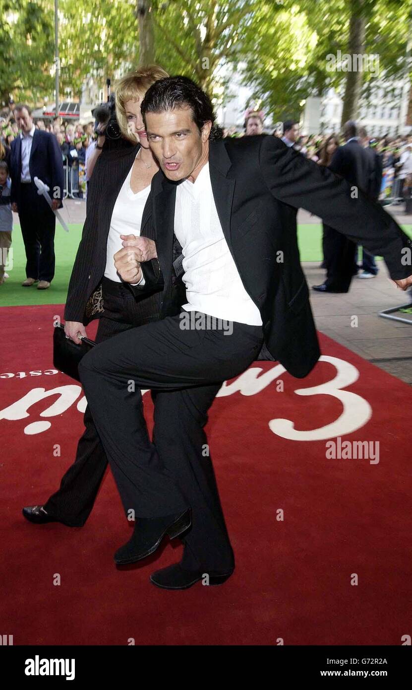 Actor Antonio Banderas, who voices Puss In Boots, with his wife Melanie Griffith, arrive for the premiere of his latest film Shrek 2, held at the UCI Empire, Leicester Square, central London. Stock Photo