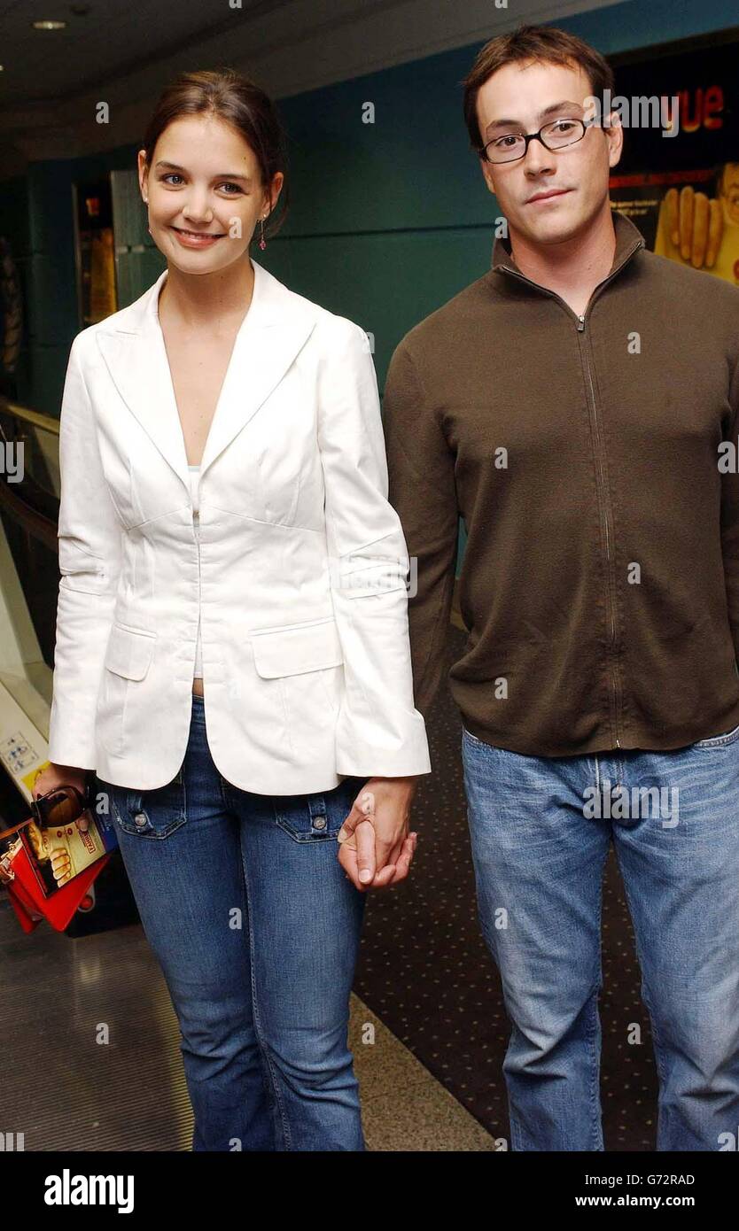 Actor Chris Klein with his girlfriend actress Katie Holmes arrive for the celebrity screening of Michael Moore's latest documentary film Fahrenheit 9/11, held at the Vue Cinema, Leicester Square, central London. Stock Photo