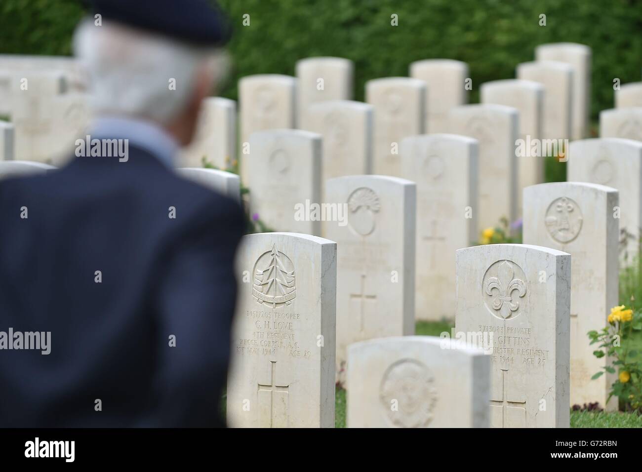 World War II veteran Tony Iacoppi, 90, from Enfield, takes a moment to reflect as he walks through British war graves in the shadow of Monte Cassino Abbey before a British commemoration service at the Cassino Commonwealth War Cemetery on the second day of his tour to Italy. Stock Photo