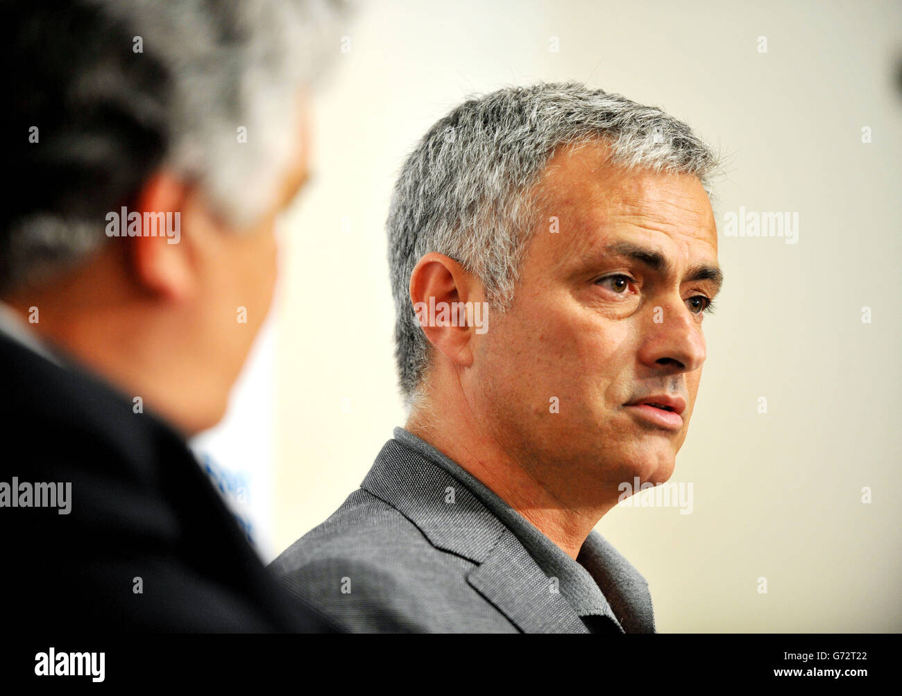 Amir Abdulla Deputy Executive Director and Chief Operating Officer, of the United Nations World Food Programme (WFP) (left) sits next to Chelsea Football Club manager, Jose Mourinho, at his announcement as the new WFP ambassador during a press conference in central London. Stock Photo